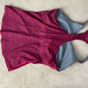 Nike tennis outfit. Racer back top with built in bra. No pads.